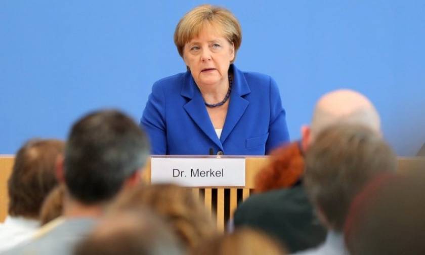 Merkel rules out migrant policy reversal after attacks