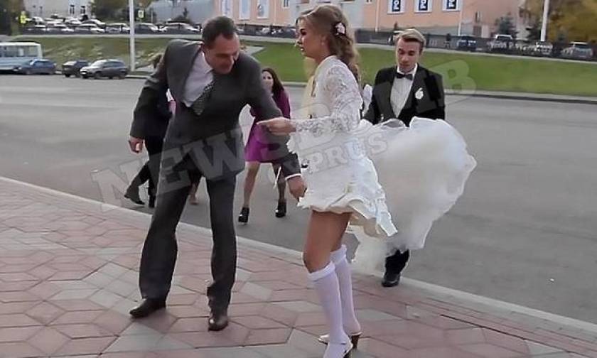 Καυτό ατύχημα για νύφη - Πώς η φωτογράφηση του γάμου της μετατράπηκε σε στριπτίζ! (video)