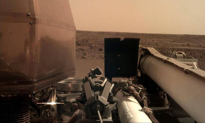 Nasa's Mars lander sends back first picture from red planet