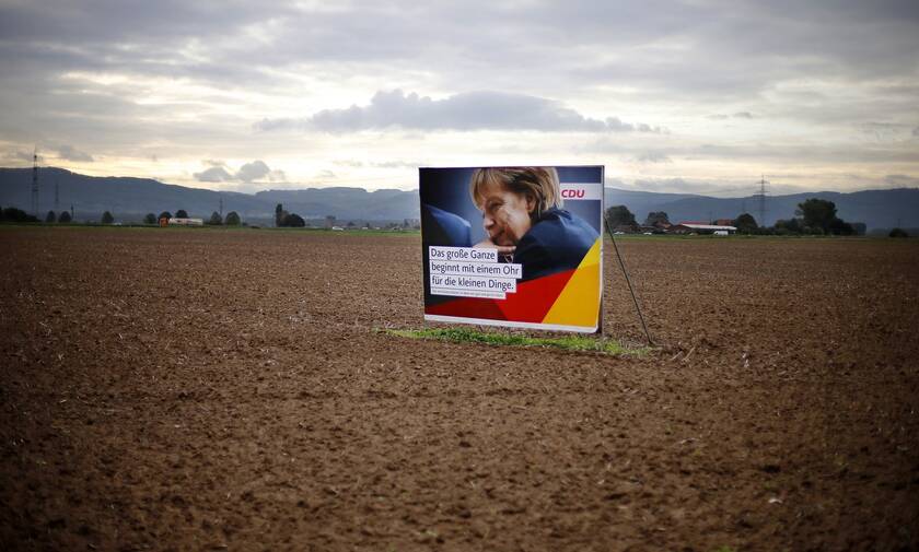 Αφίσα της Μέρκελ έξω απο τη Φρανκφούρτη